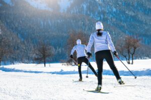 Couple man and woman cross-country skiers